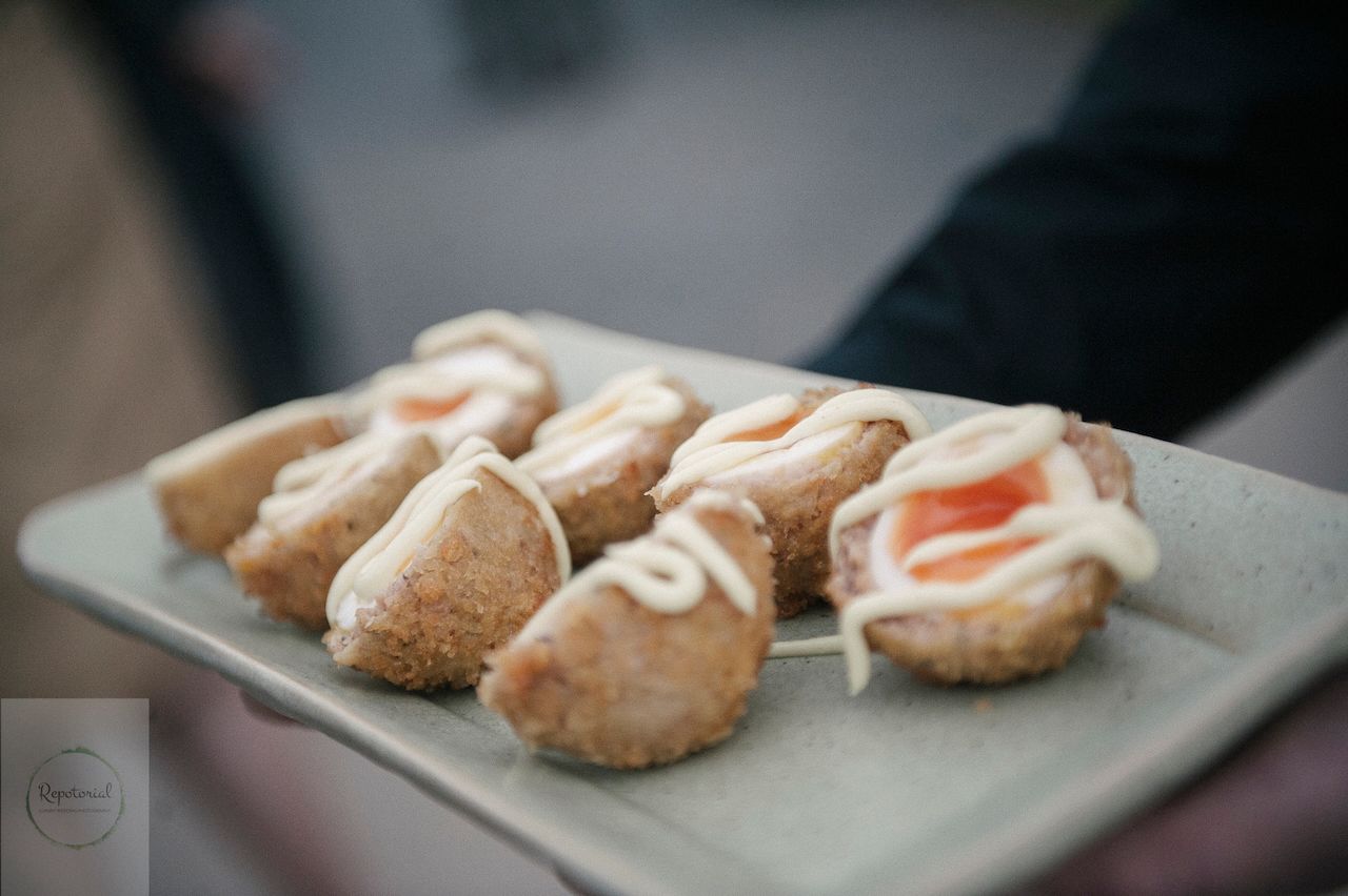 Reportage detail shot of wedding reception canapés being served