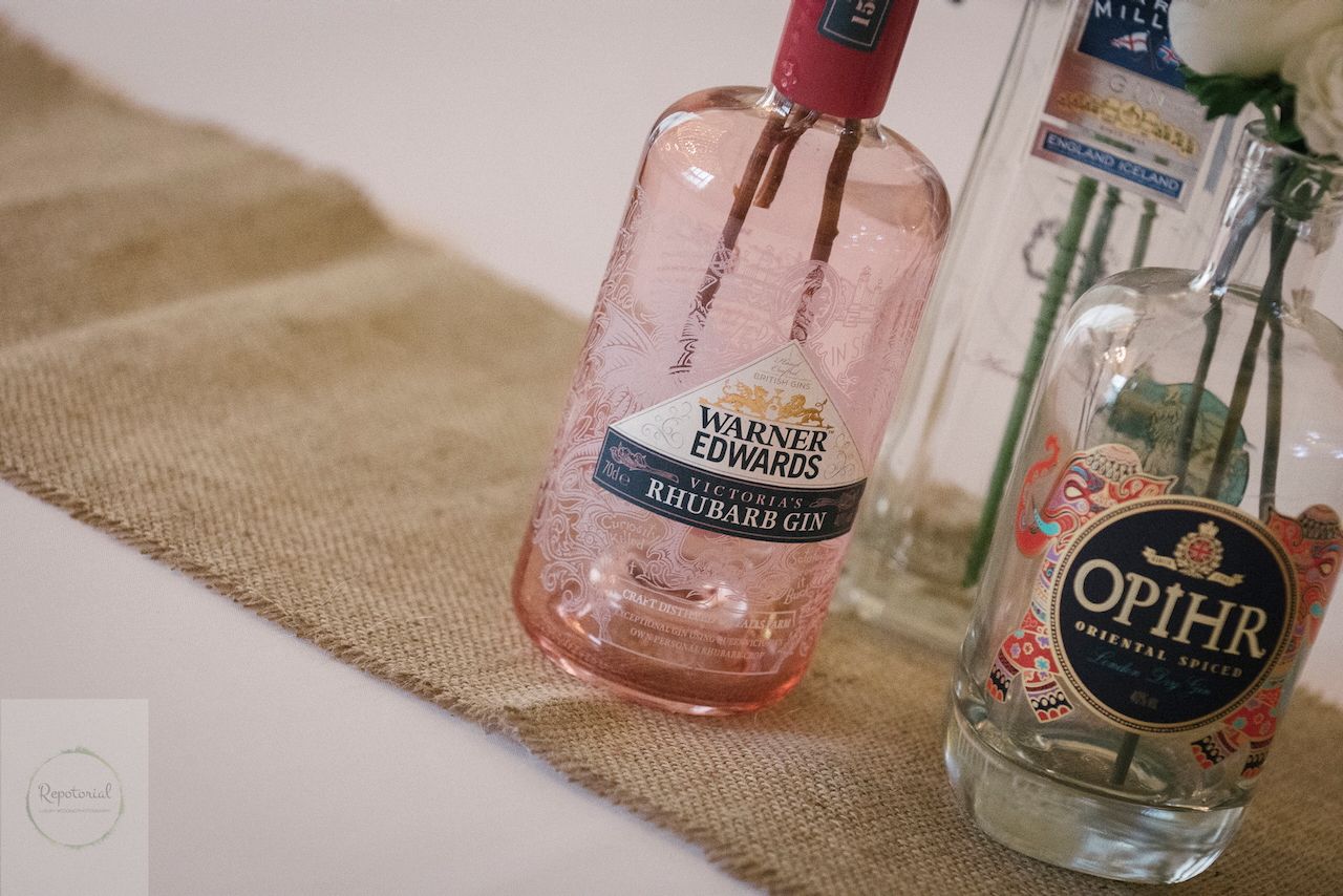 Reportage detail shot of gin bottle being used as a flower vase