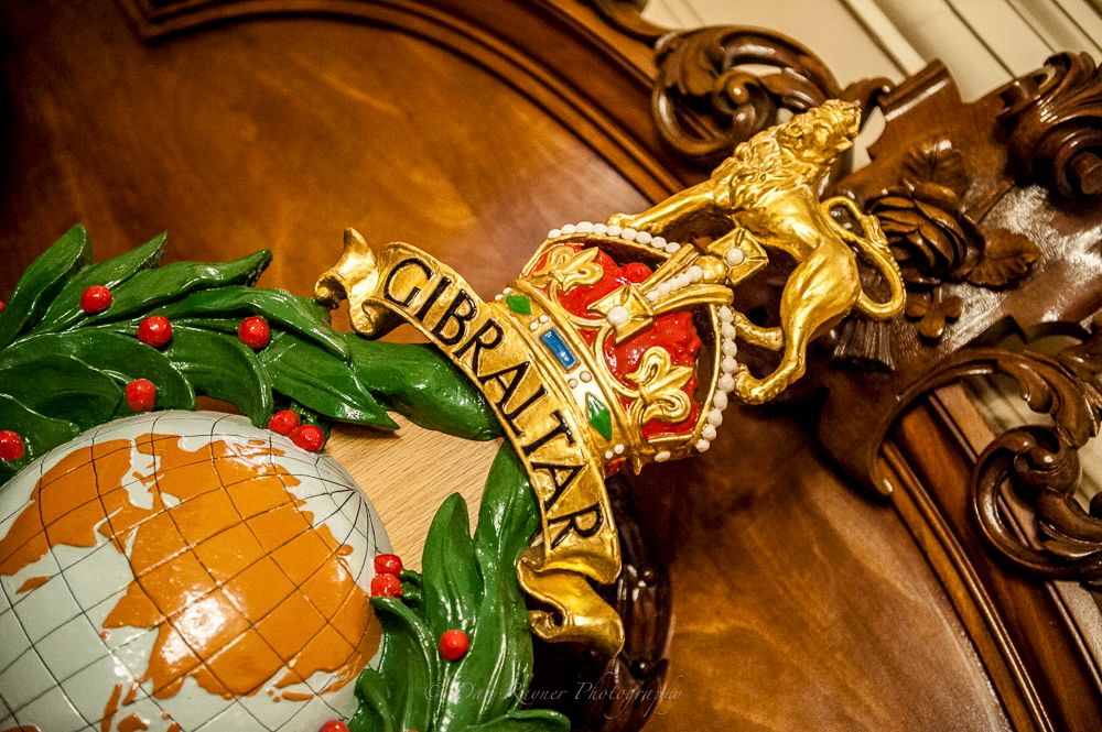 Reportage detail shot of royal marine crest, location of wedding reception