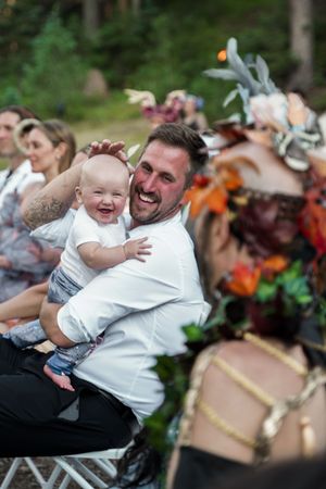 Candid moments of laughter and joy during a festive outdoor wedding celebration.