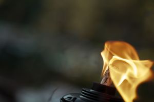 Warm flames dancing in the evening air during an outdoor celebration.
