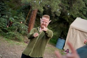 Forest wedding celebration with candid moments captured in natural lighting.