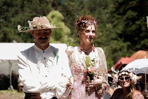 Celebratory moments captured during an outdoor wedding reception with pink and white decorations.