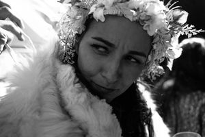A black and white photo collage strip showing grainy romantic portraits in vintage style.