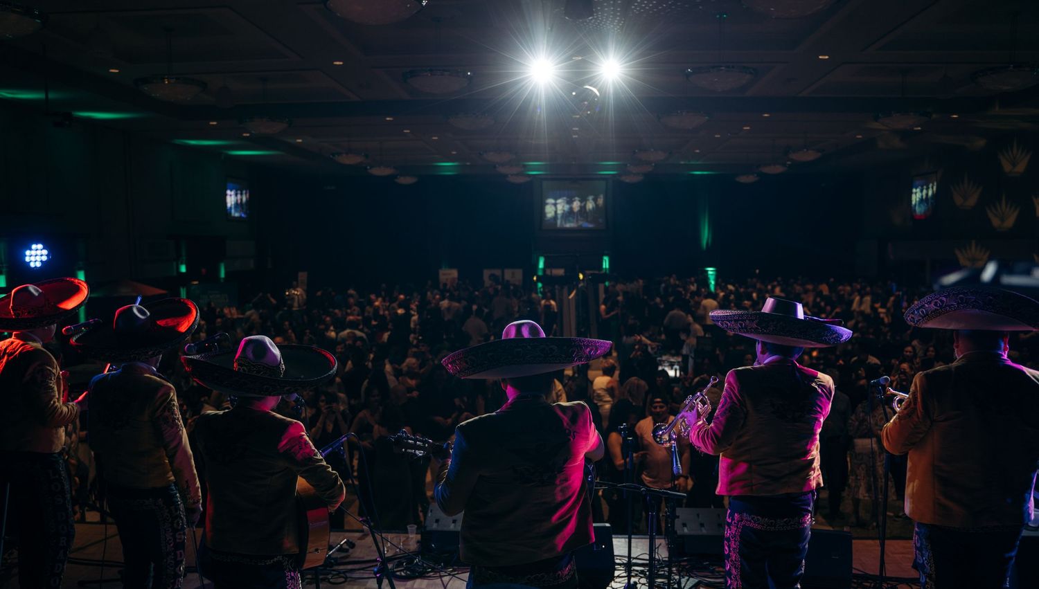 Mariachi band performing on stage with colorful lights before a large crowd in a darkened venue.

Vancouver Canada Scene