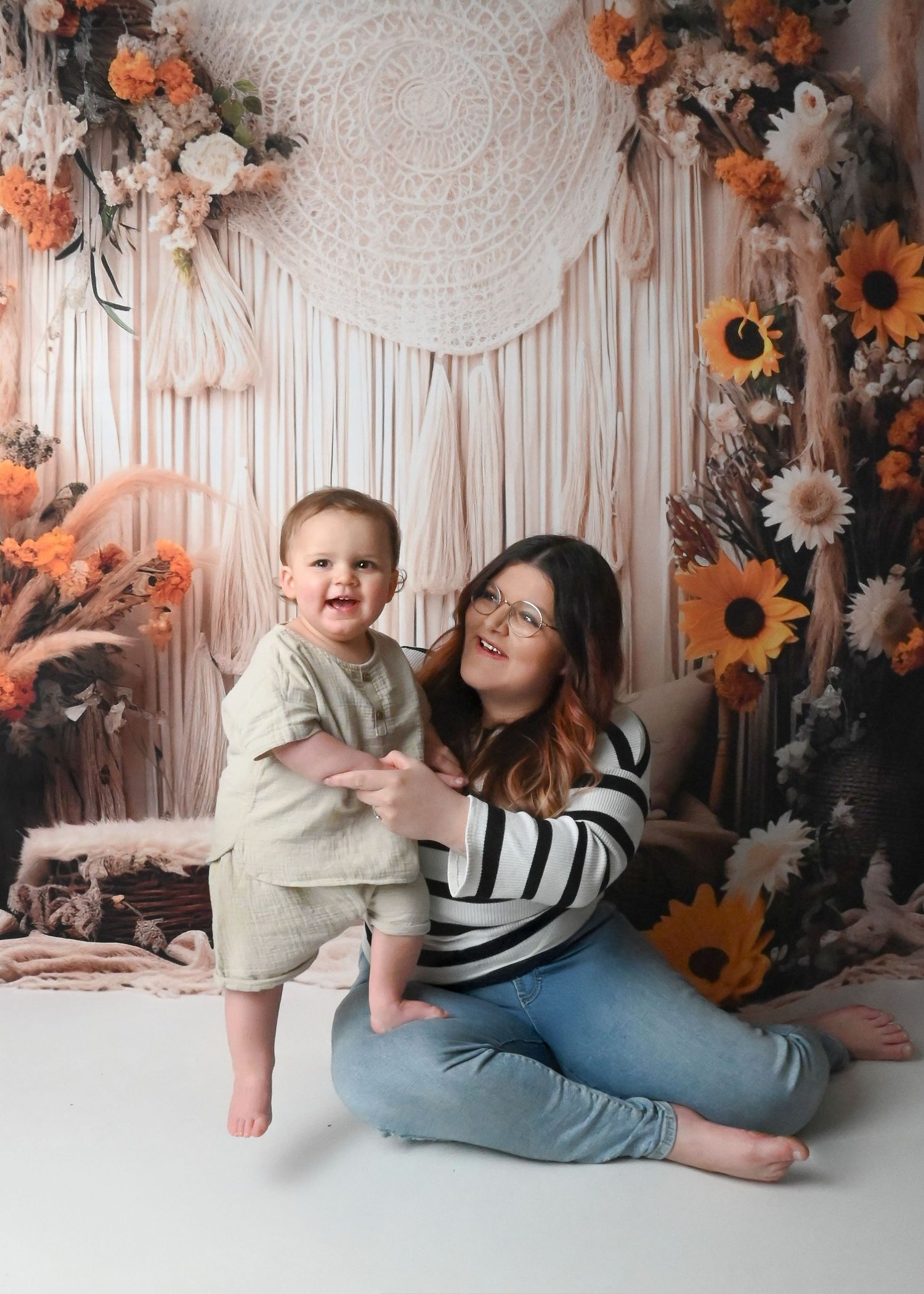 Playful photo series with floral backdrop featuring sunflowers and decorative elements.