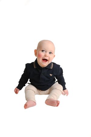 Baby in navy sweater and cream pants sitting against white background in progressive poses.