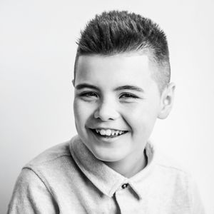 Black and white portrait series showcasing genuine laughter and personality.