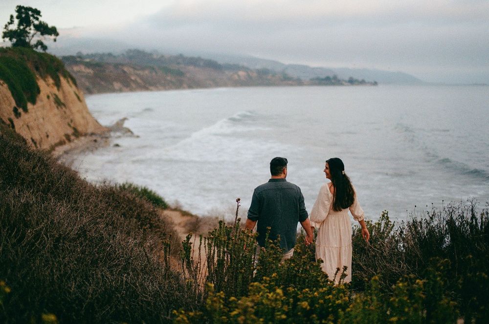 Santa Barbara film photographer capturing the bride and groom overlooking the scenic Carpinteria Bluffs.