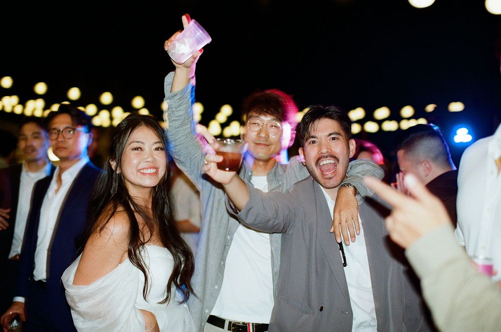 High-energy Orange County film photography of a wedding guest dance party on 35mm film.