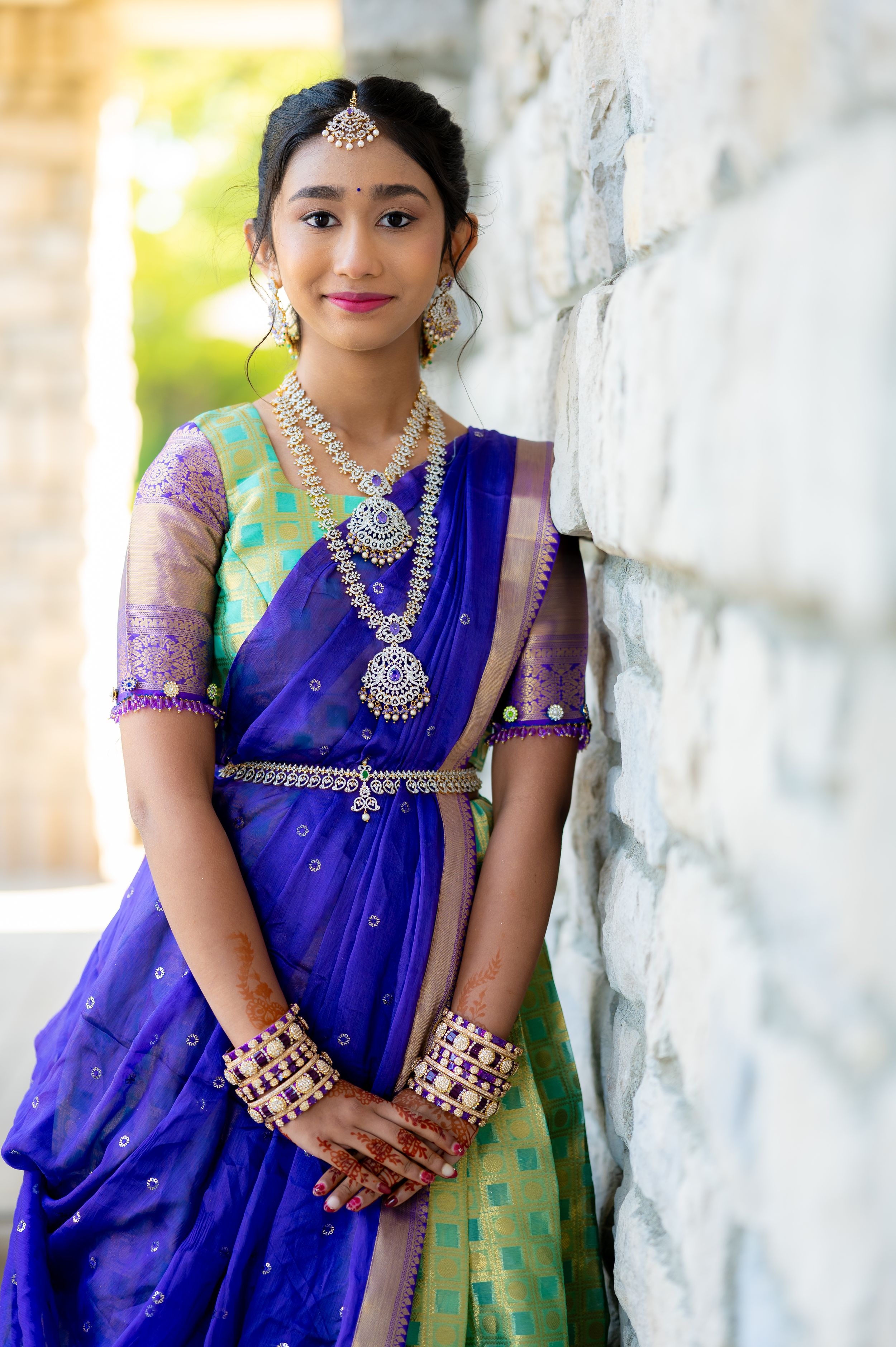 Close-up shots of traditional Indian attire and jewelry details.