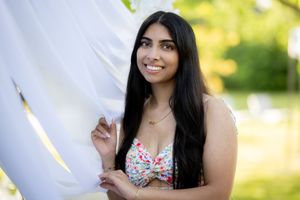 Outdoor portrait series featuring a woman in a floral dress.