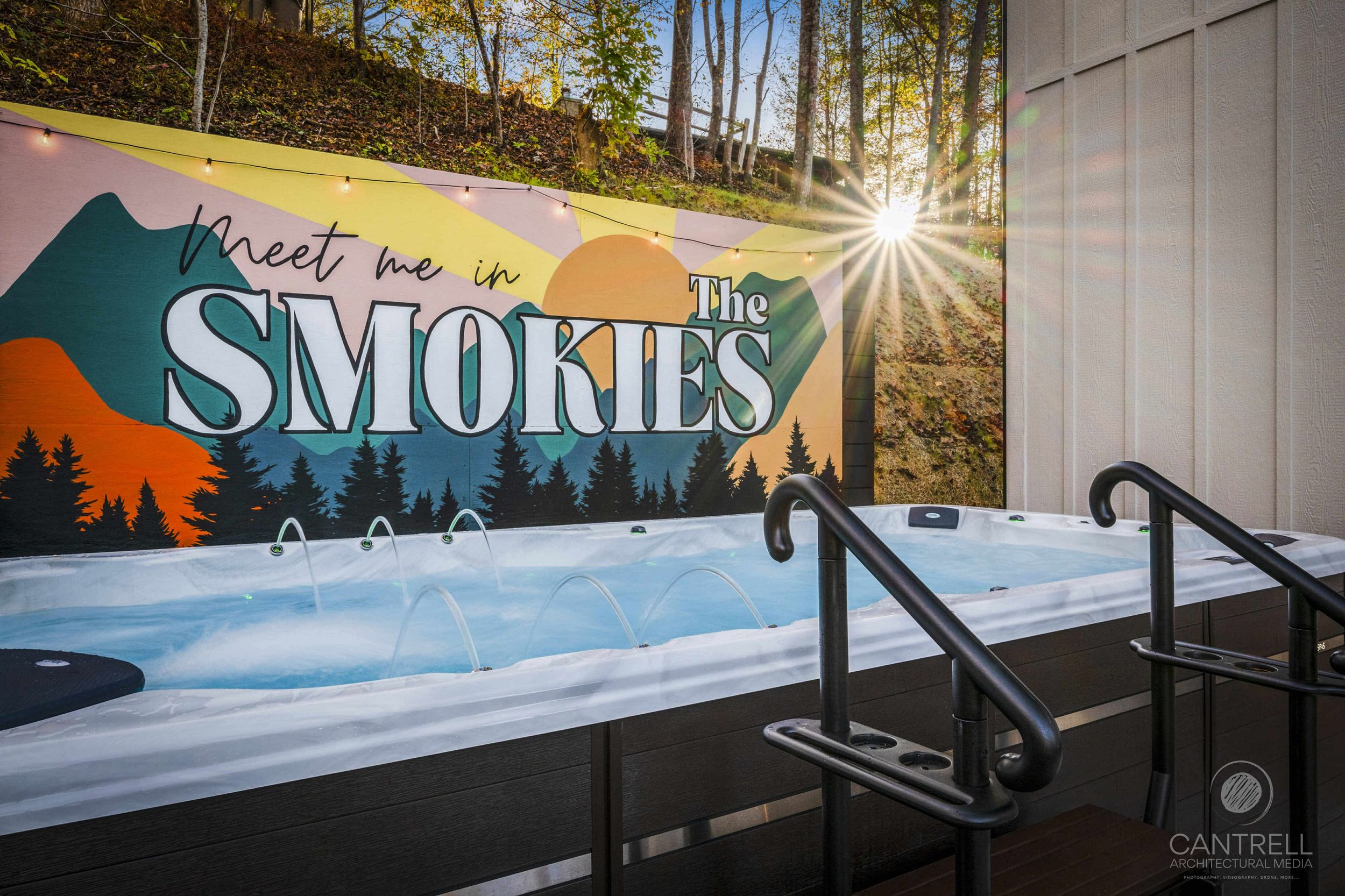 Meet me in The Smokies mural on wall by the swim spa at the short term rental in Gatlinburg, TN.