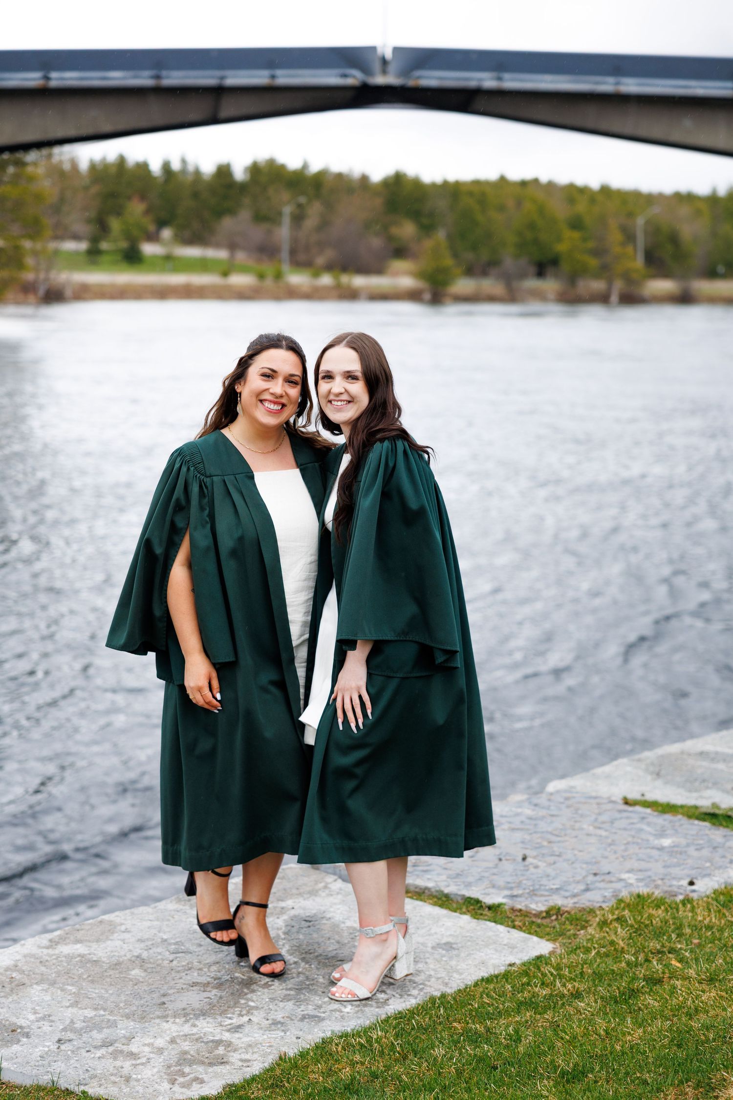 A couple holds each other and poses for a photo after their wedding reception in Peterborough Ontario