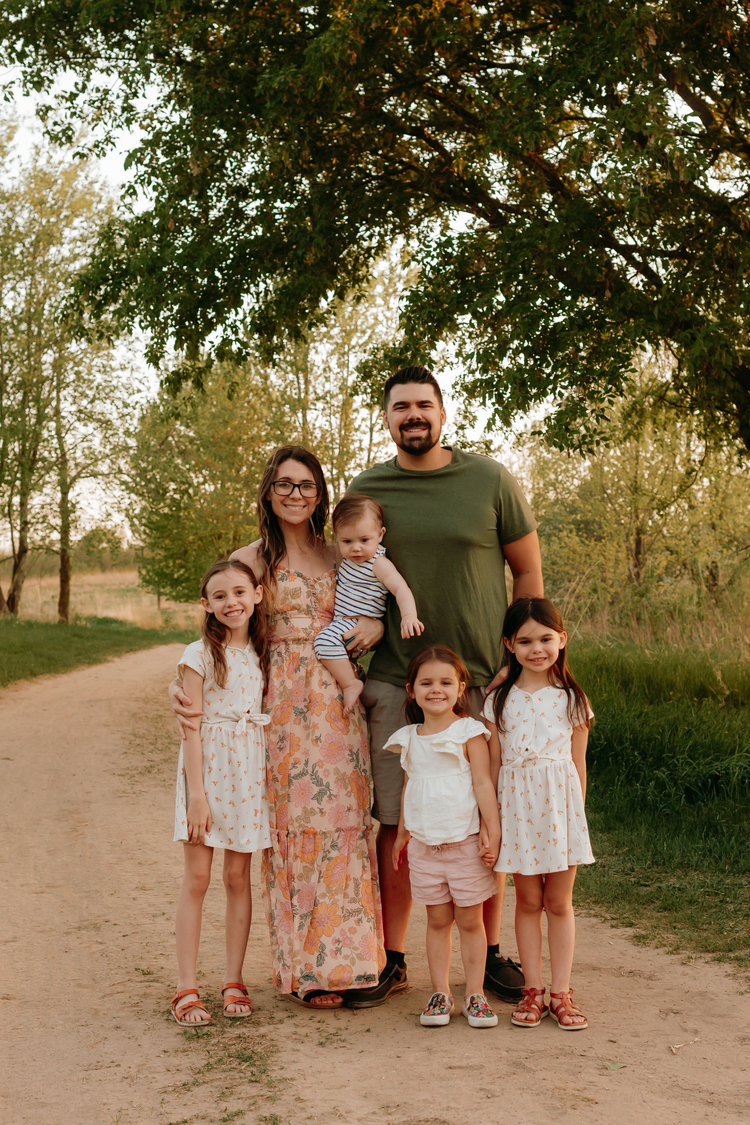 Family all standing together smiling at Lake Elmo Park Reserve