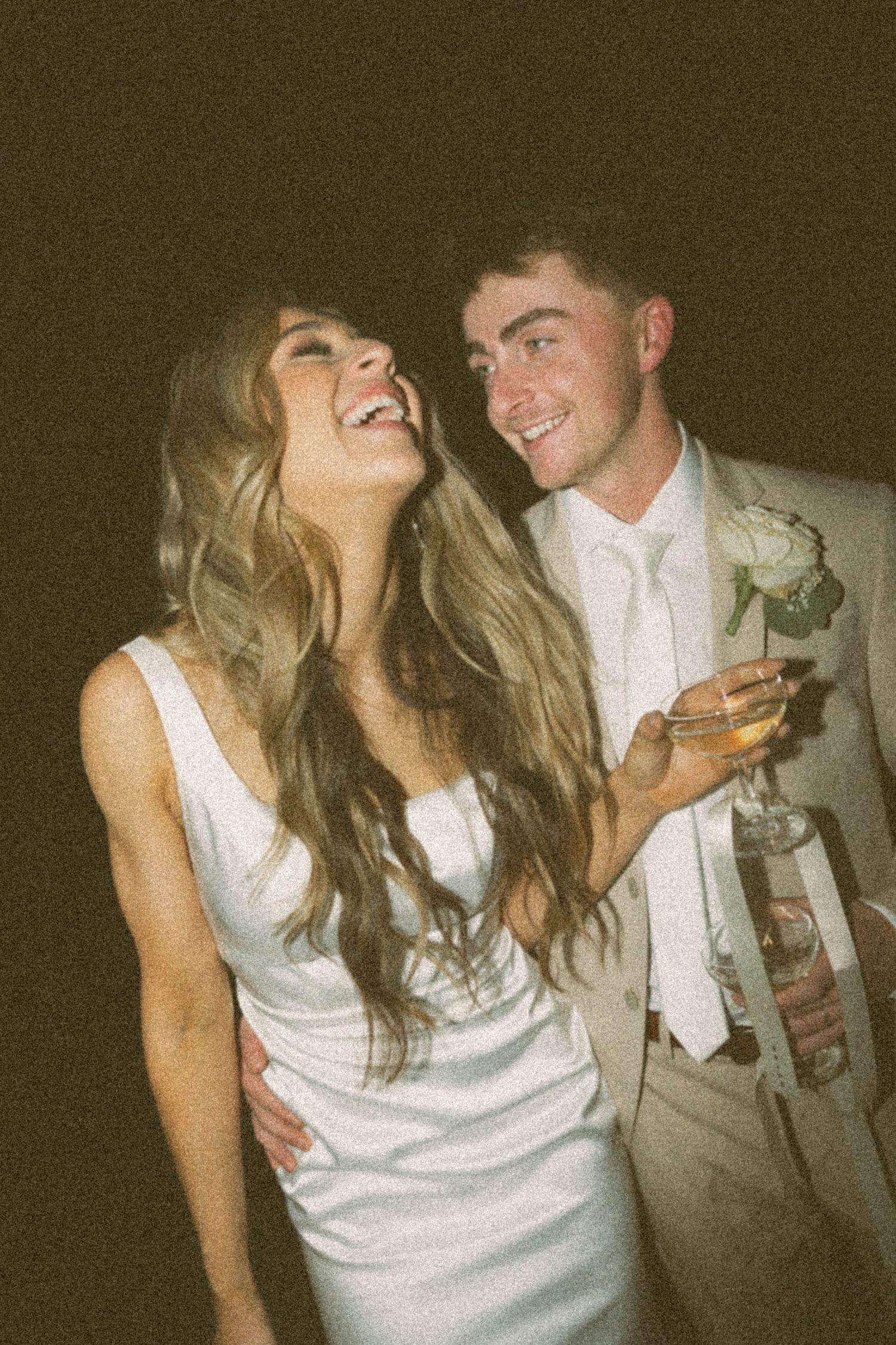 A series of candid party photos showing a couple in white and gray formal attire dancing and laughing together.