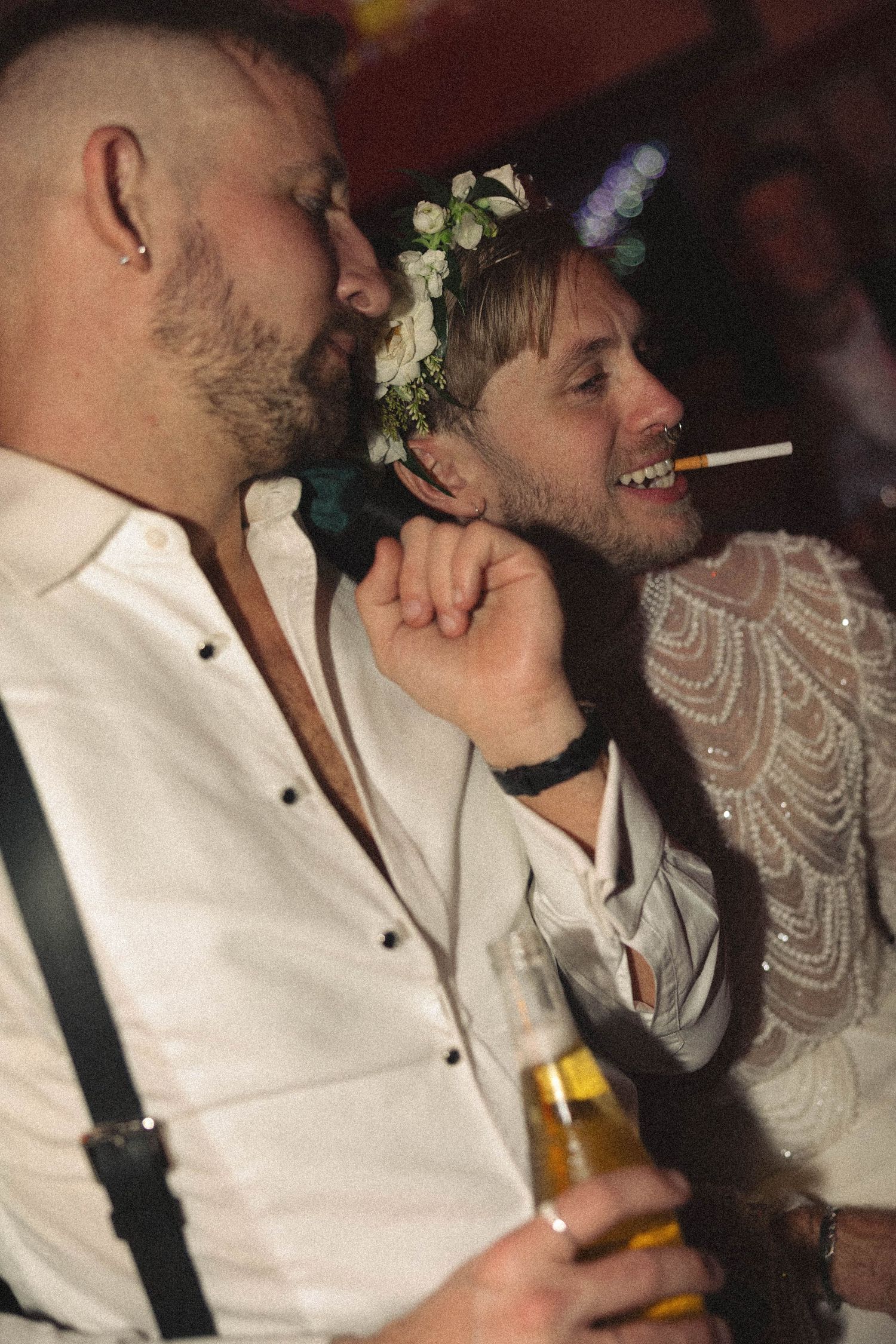 A sequence of candid party photos showing people in white shirts and suspenders enjoying drinks and laughter together.