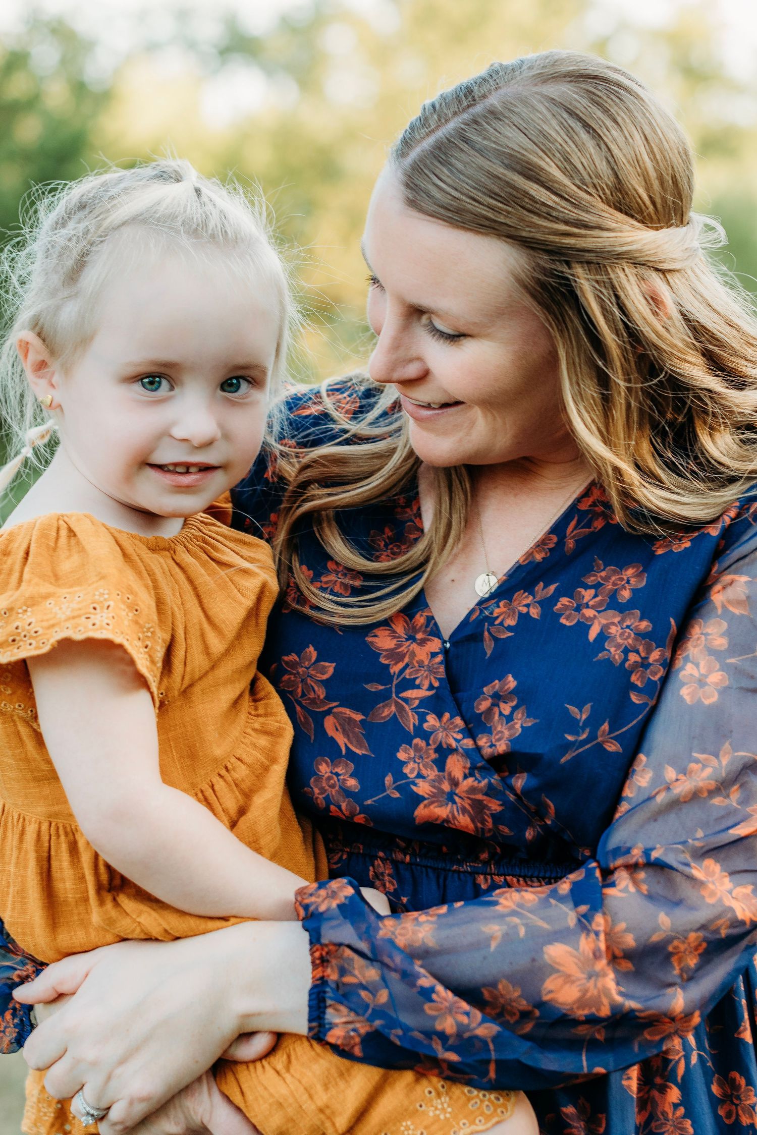 A mother and daughter snuggle during a fall family photography session in South Jersey.