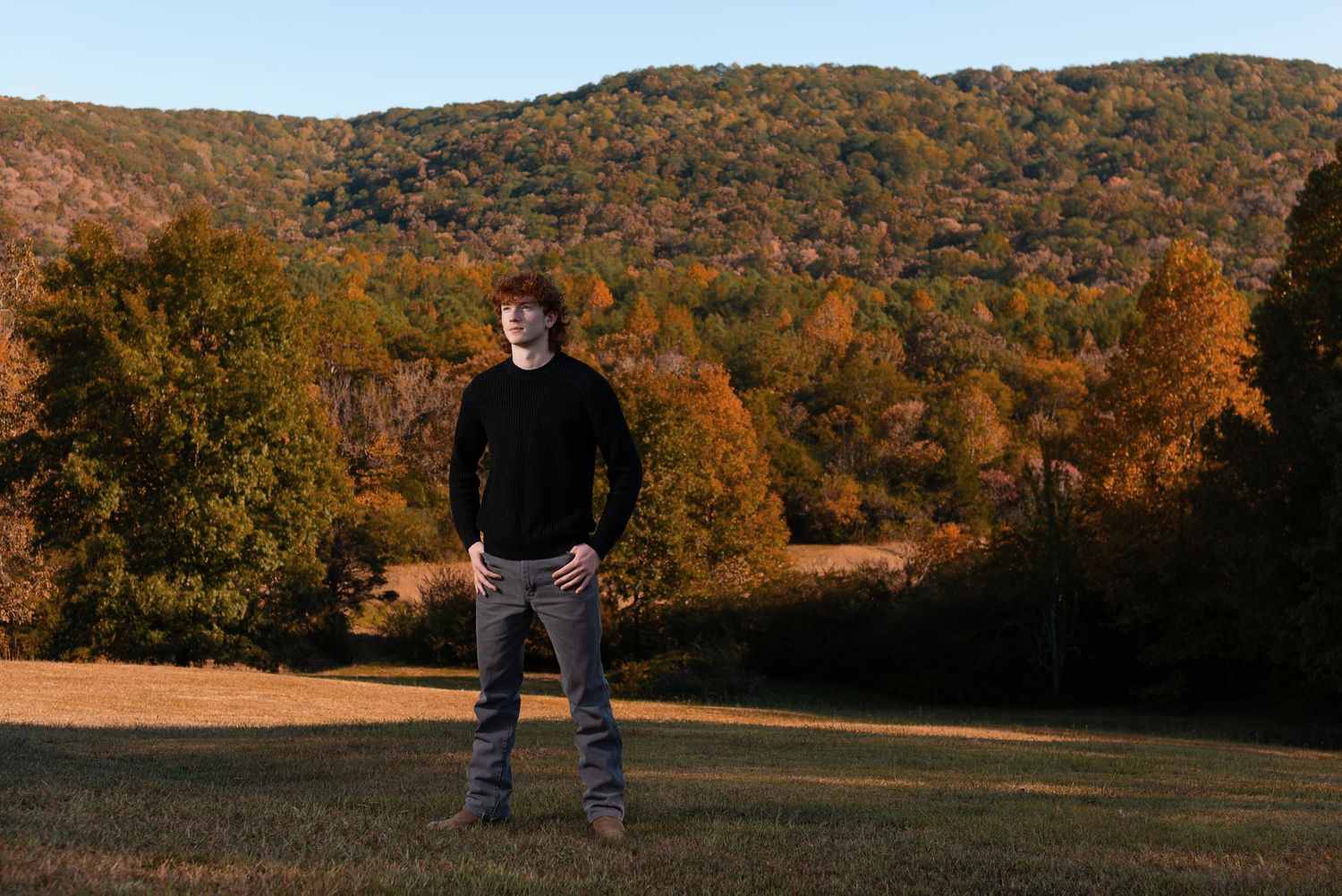 High school senior boy portrait with mountains behind
