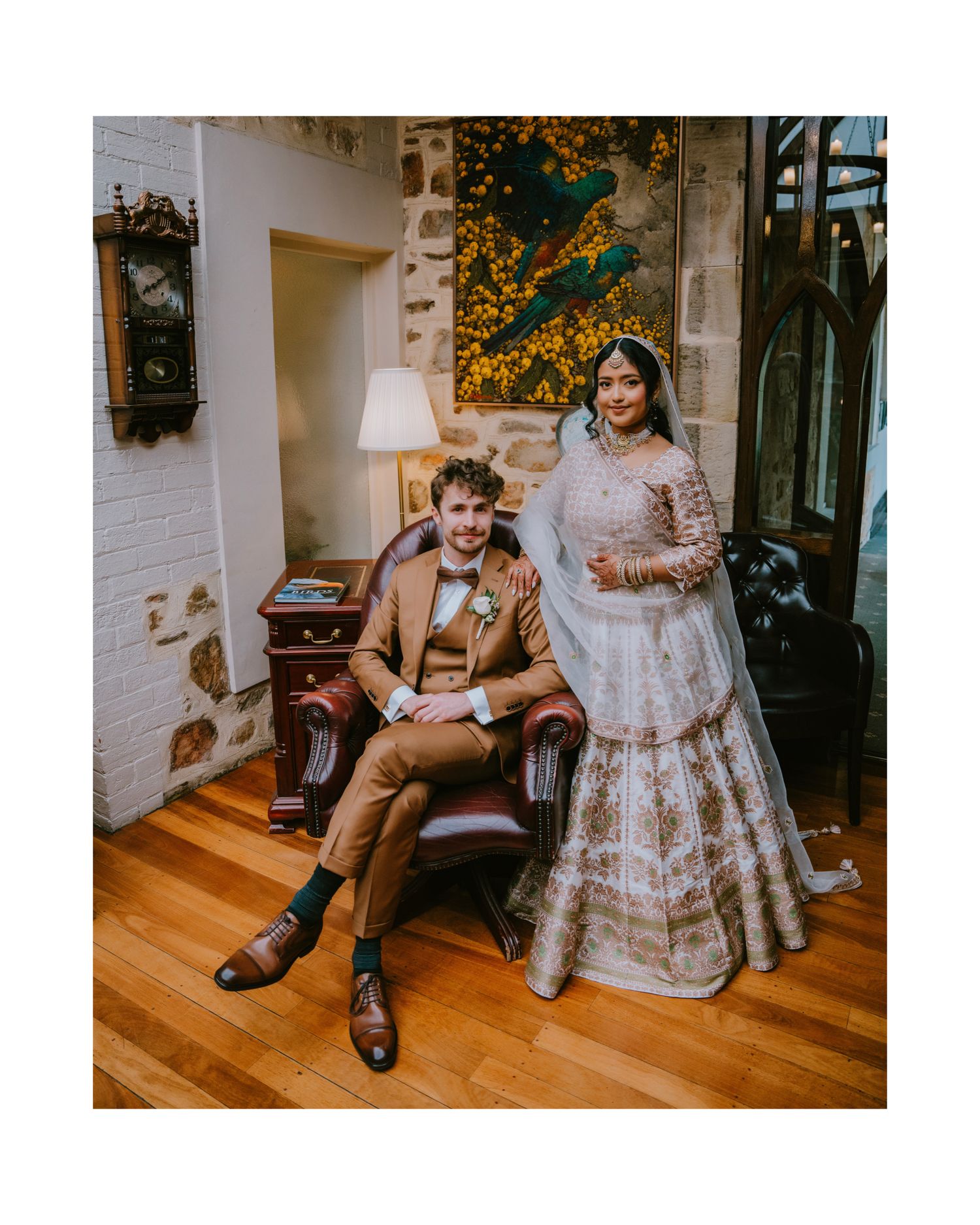 Groom in a tan three-piece suit with his bride in an embroidered lehenga and veil - Adelaide wedding portrait photography