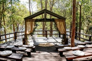 Rustic, lakeside outdoor ceremony at Walkabout Creek, wedding venue