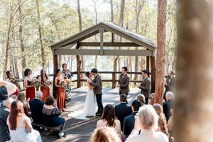 Wedding ceremony at Walkabout Creek, Brisbane rainforest lakeside wedding venue