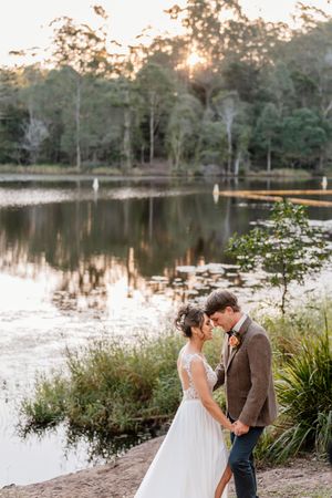 Lakeside Wedding portrait at Walkabout Creek, Brisbane rainforest wedding venue