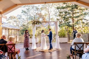 Rain-safe outdoor wedding ceremony at Walkabout Creek, Brisbane wedding venue