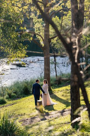 Lakeside Wedding portrait at Walkabout Creek, Brisbane rainforest wedding venue