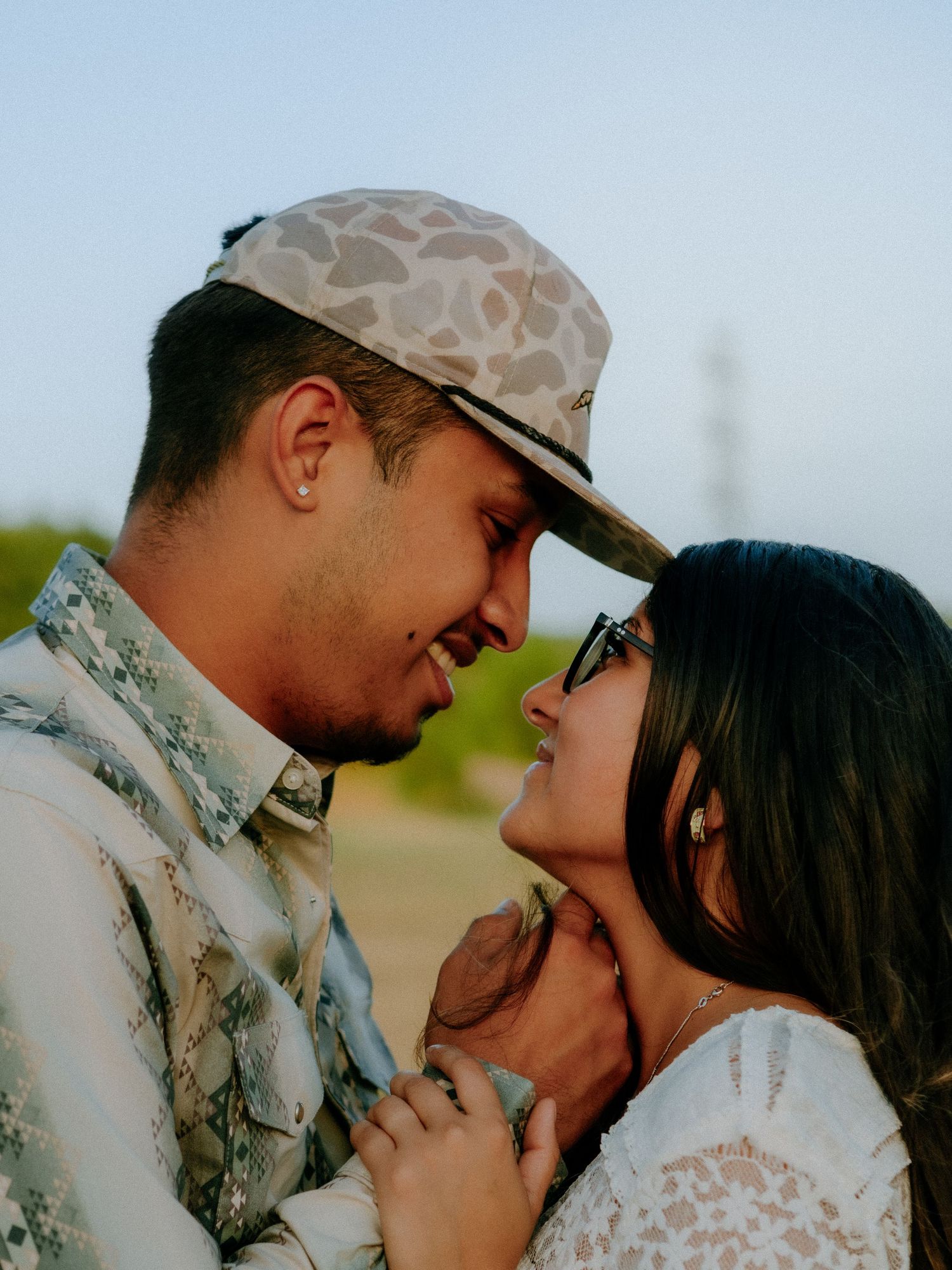 couple gazing into eachothers eyes at barley meadows park