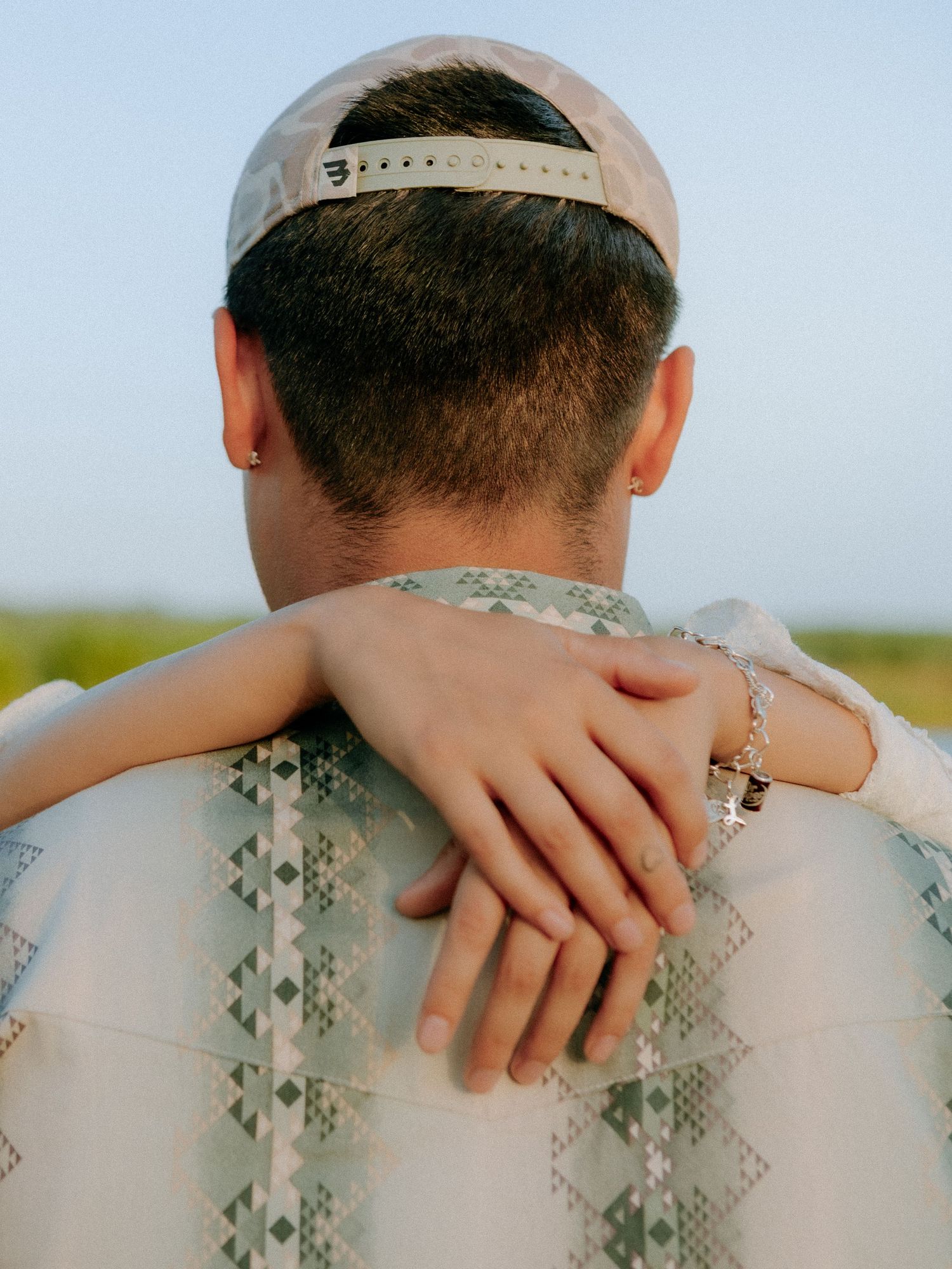 close up of couple hugging at barkley meadows park.