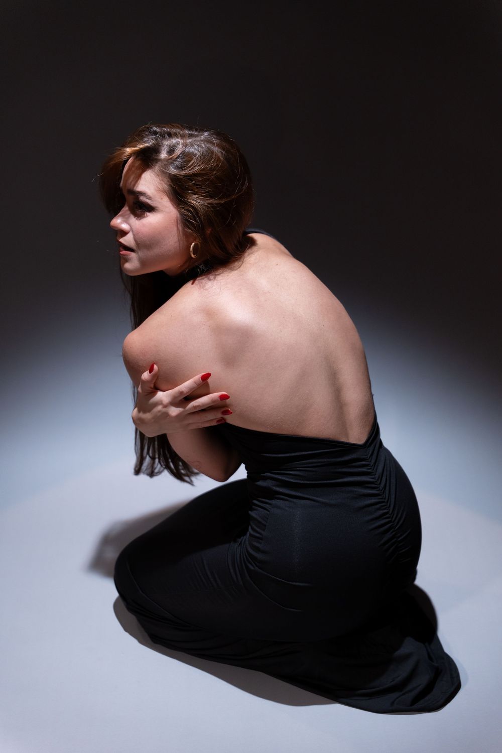 Creative editorial studio portrait with dramatic lighting in Miami. By OKataStudio