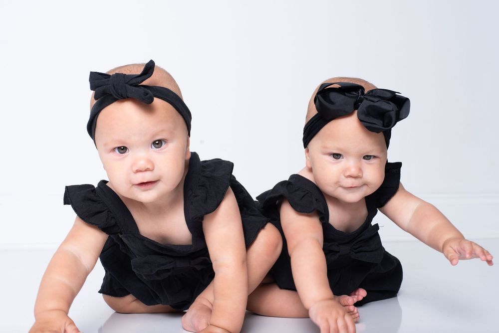 Twin babies crawling during 6 month milestone photography session