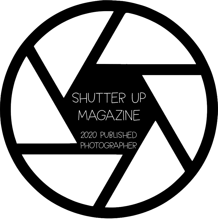 Shutter Up Magazine 2020 Published Photographer badge shaped as camera aperture logo.