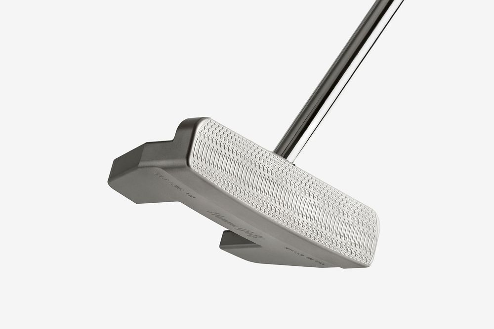 Silver golf putter with white textured face and steel shaft on white background.
