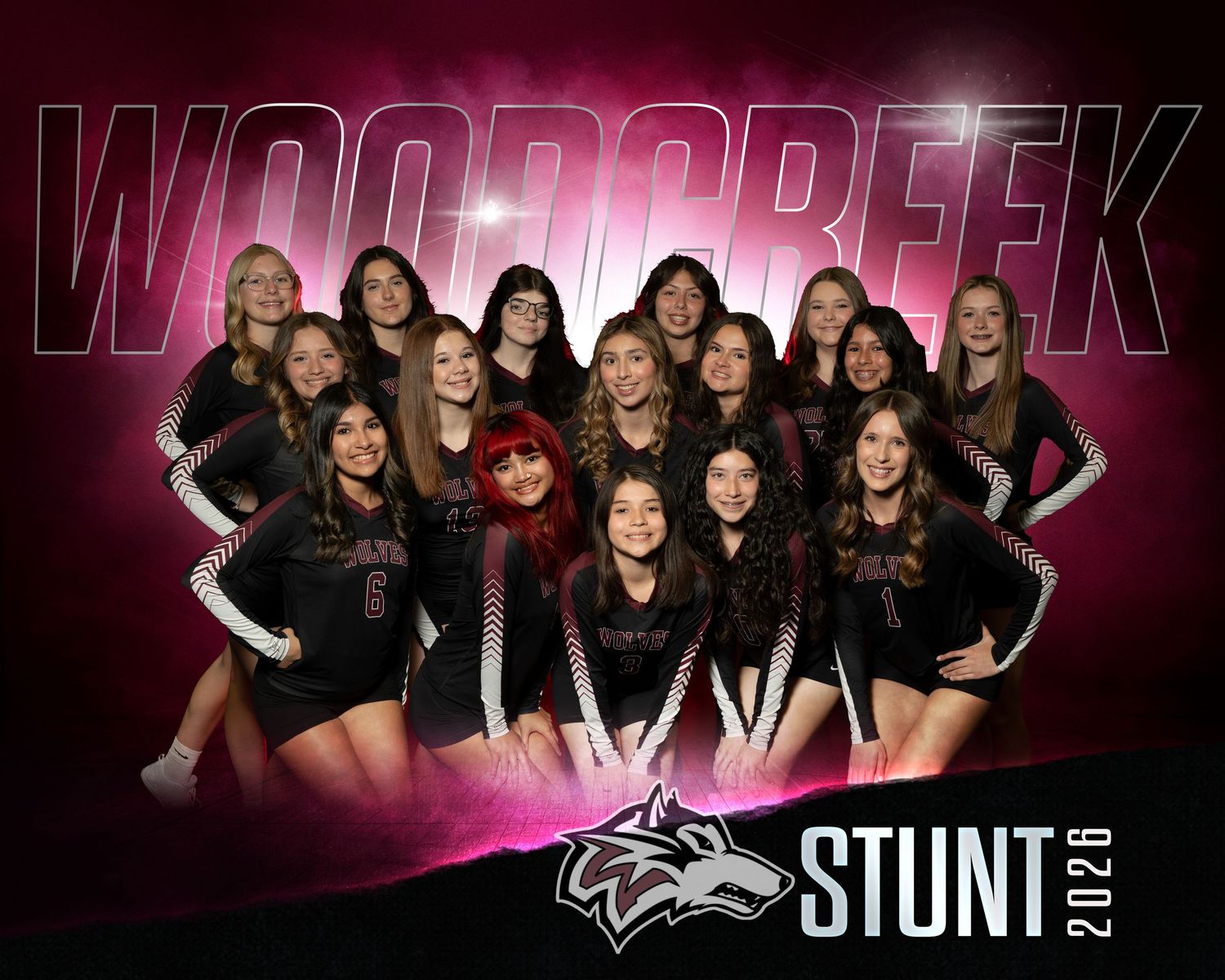 Woodcreek Stunt 2026 team photo featuring a group of female athletes in maroon uniforms posed together.