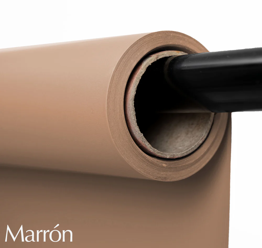 Brown paper photography backdrop roll mounted on black support pole for studio use.