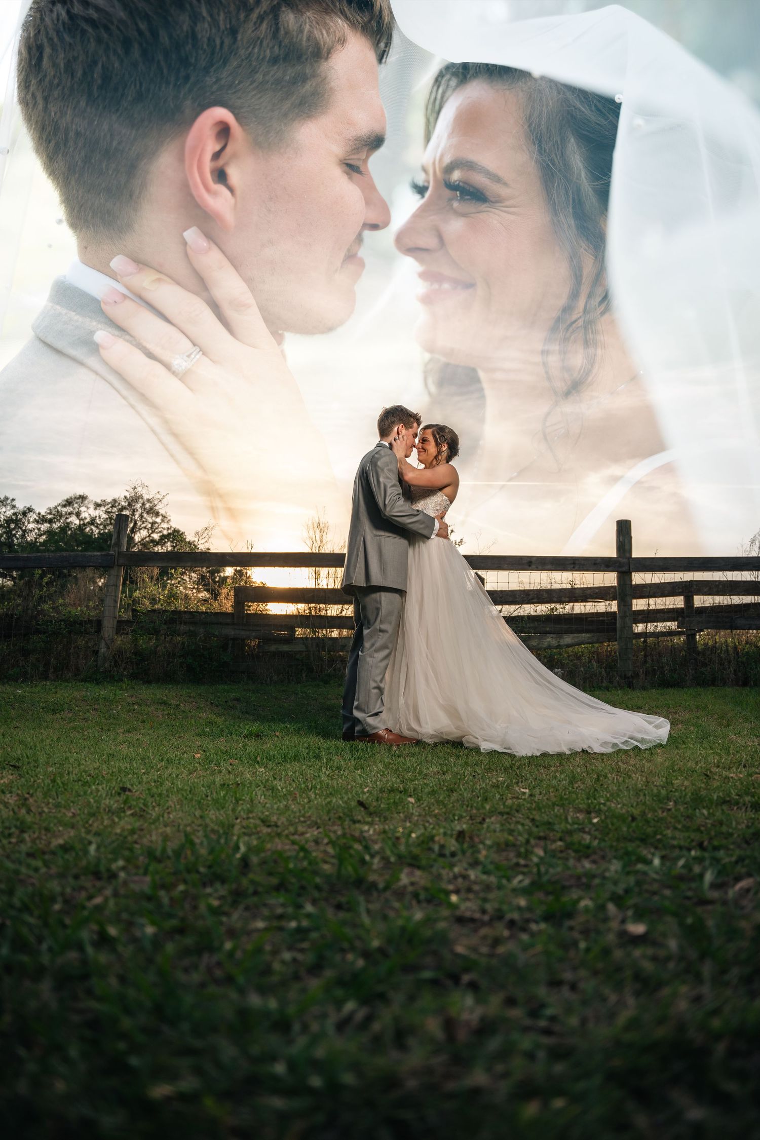 Double exposure wedding photo of bride and groom embracing at sunset near a rustic fence, with close-up faces overlaid.
