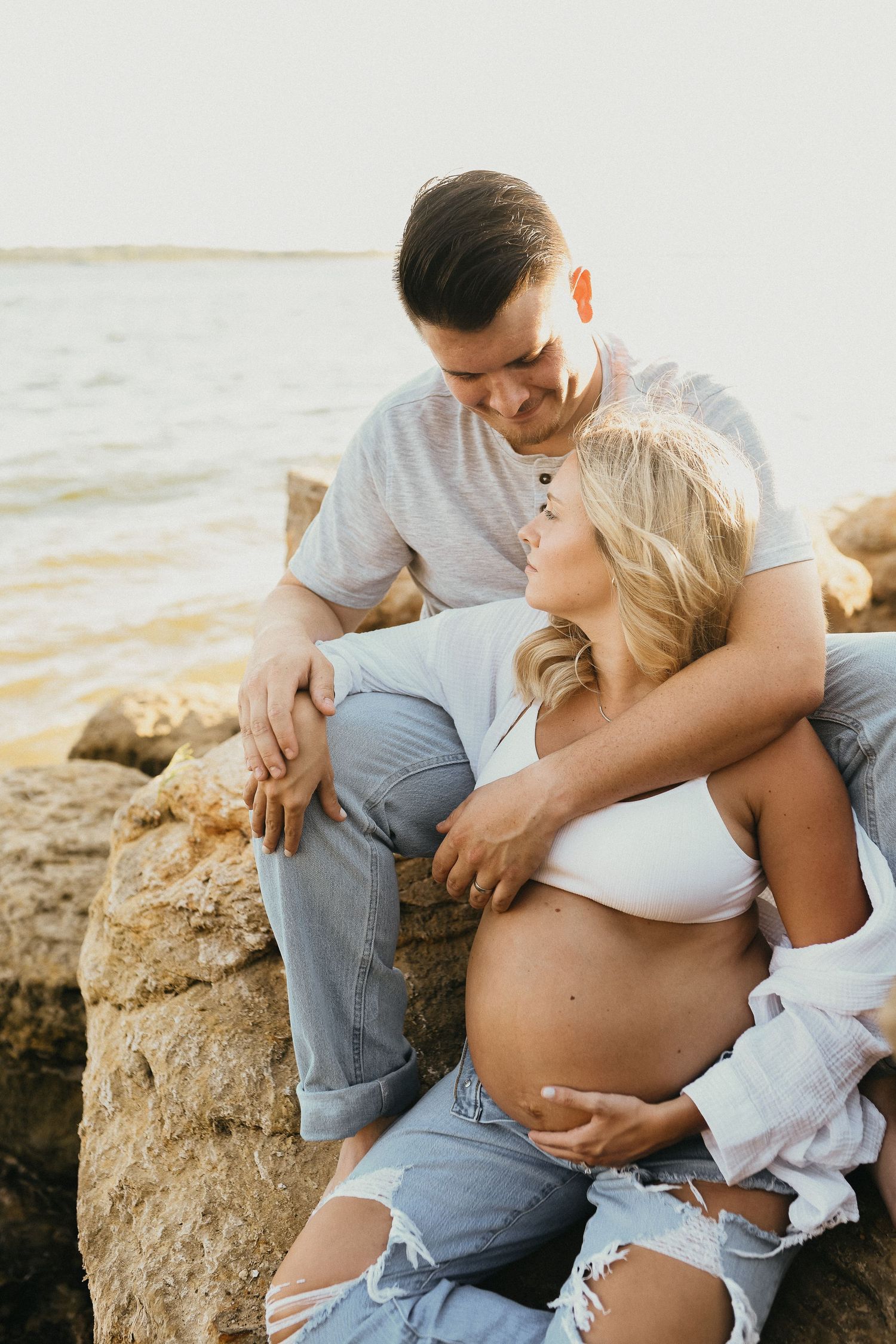 Lakeside maternity photos of mom and dad during sunset in the Dallas Fort Worth area