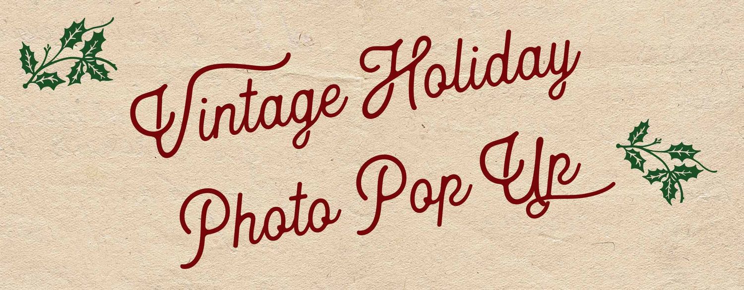 Vintage Holiday Photo Pop Up event sign with festive red cursive text and holly decorations on aged parchment background.