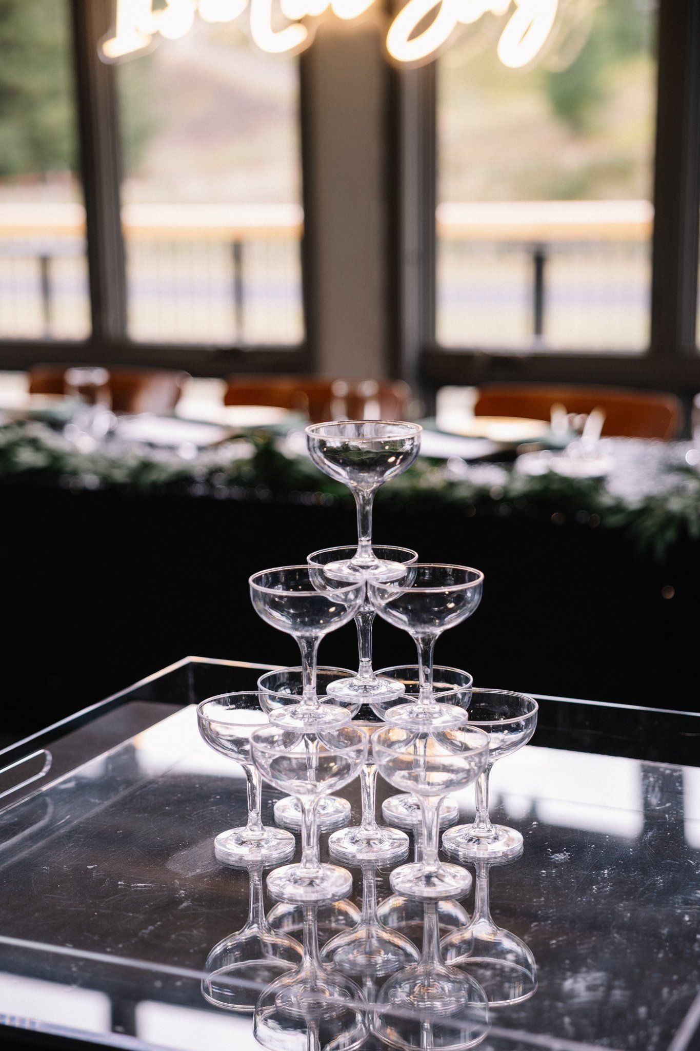 Champagne tower at Allison and Matt's Rundleview Room wedding reception, Canmore Nordic Centre