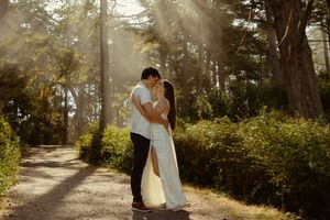 Cinematic moment of a couple sharing an intimate moment at Deception Pass, WA during an engagement session, Captured by Savvy Photography.
