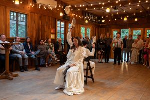 A couple playing games at their reception at Tree House Point, WA, Captured by Savvy Photography