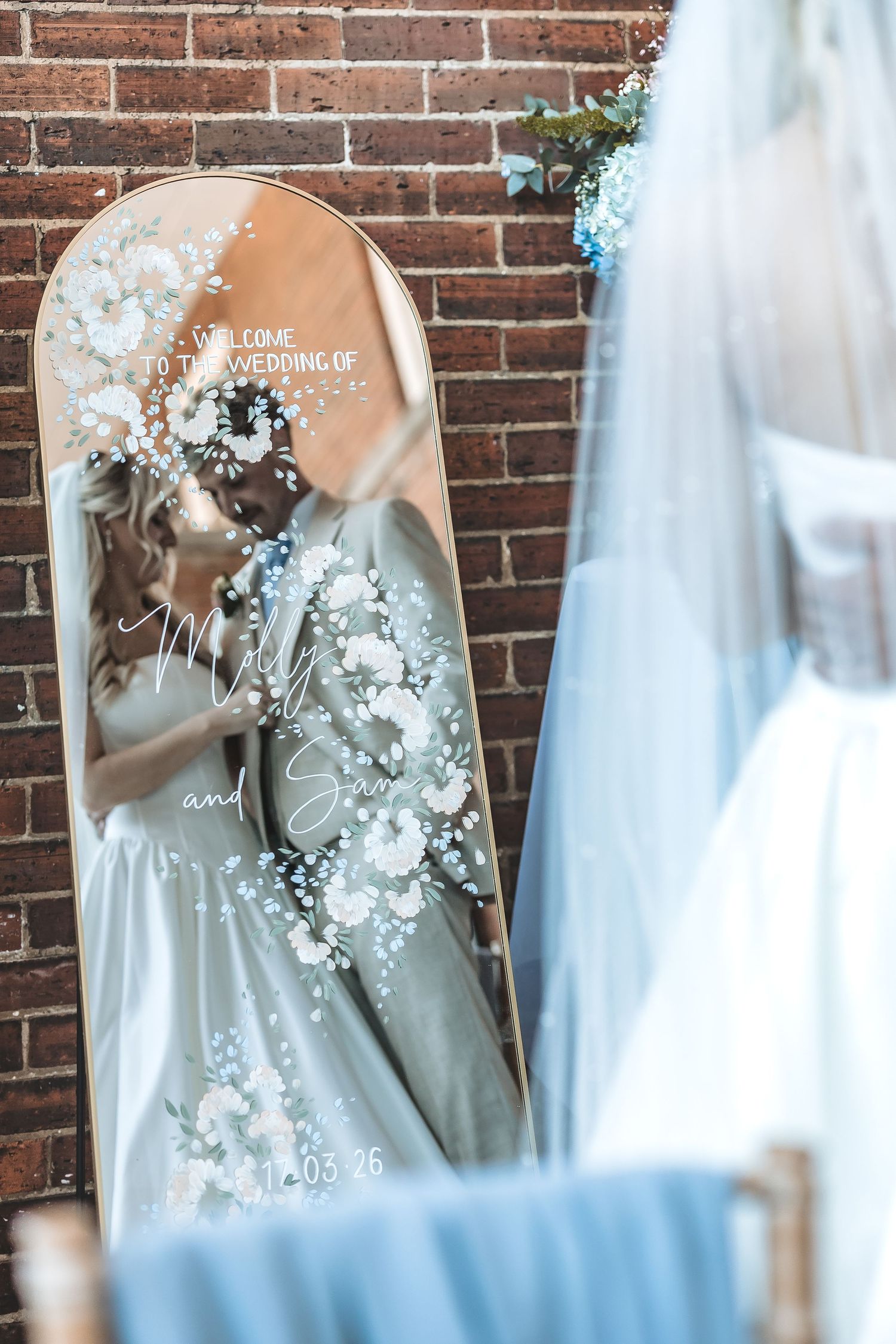 in the moment shot of bride and groom in a mirror at Charlotte House wedding venue.
