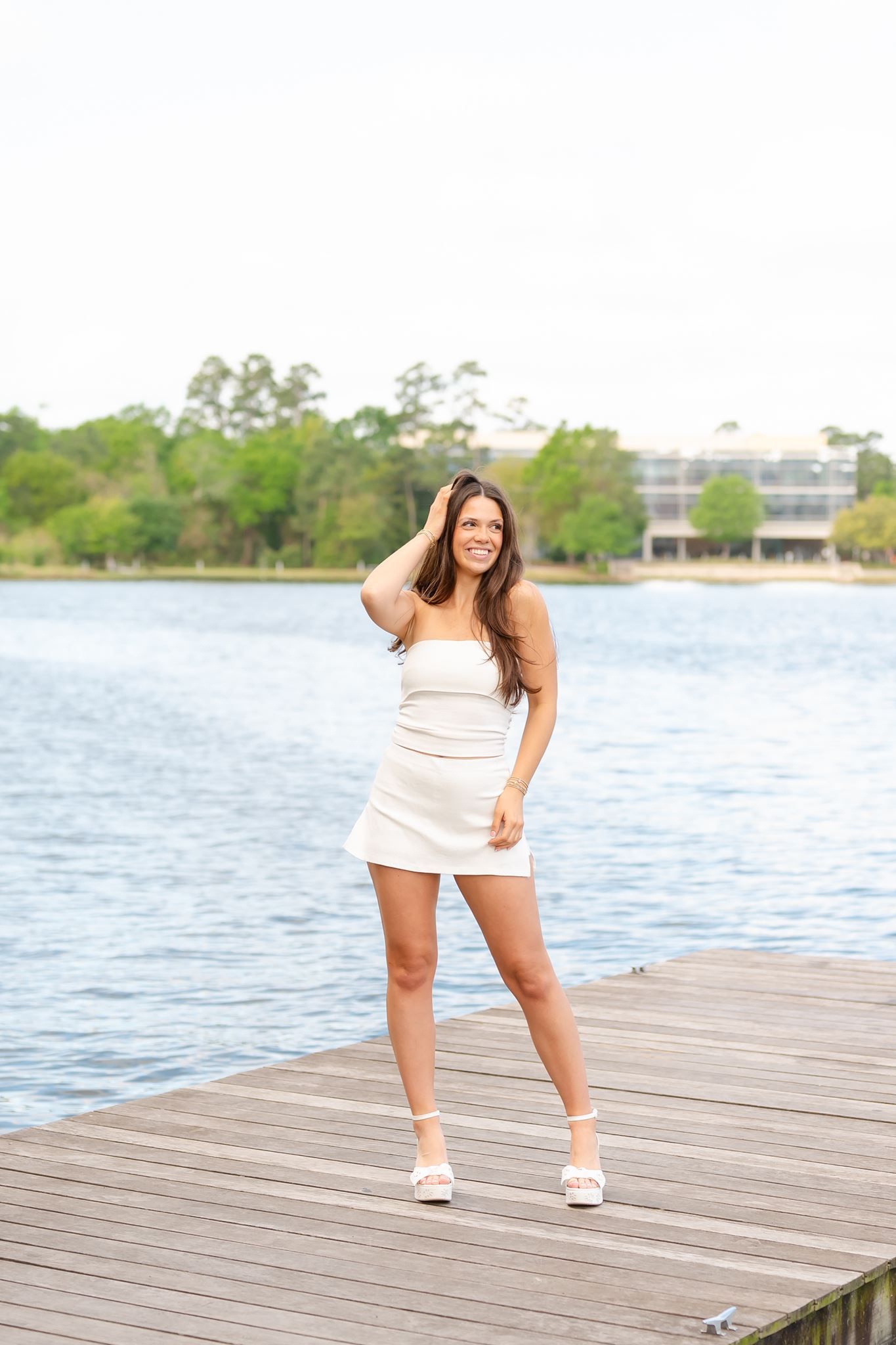 Tomball High School senior girl posing on a boat dock in The Woodlands Texas