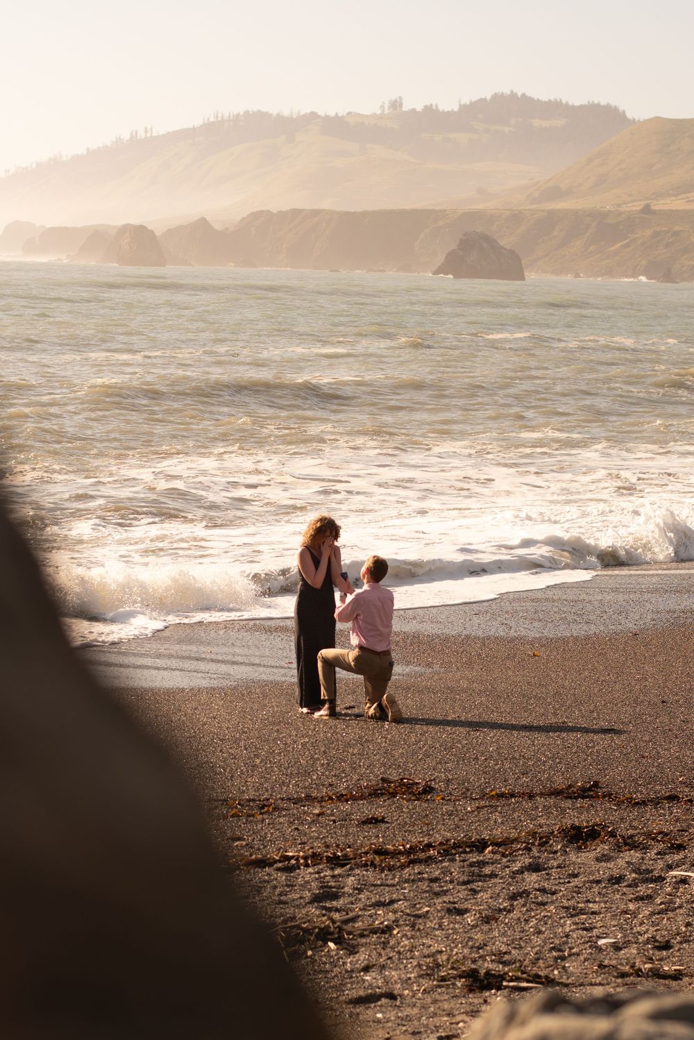 Cinematic beach proposal photography on the Sonoma Coast, capturing the surprise, emotion, and love of a moment they’ll never forget.