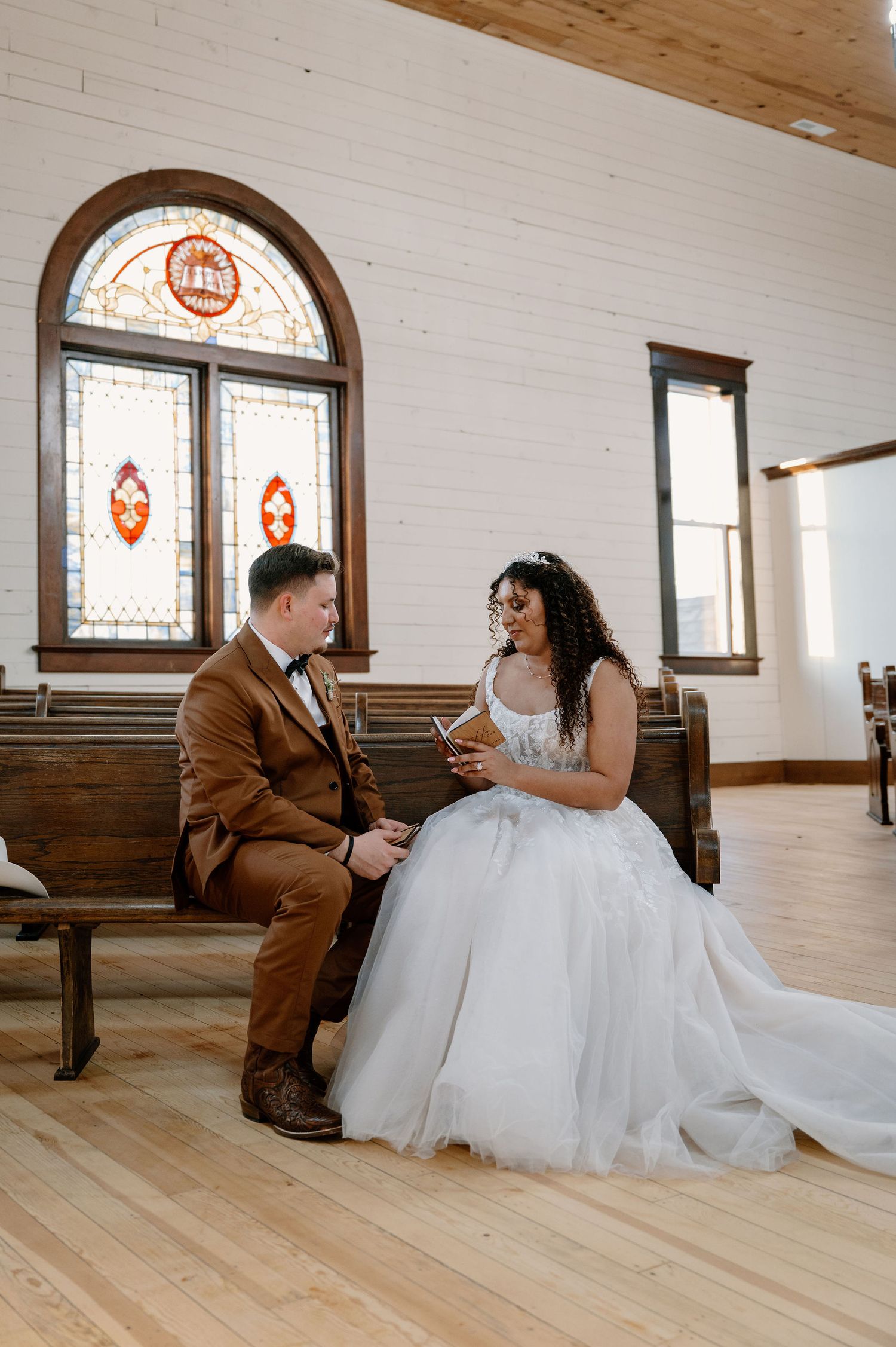Private vows at The Scotsman in Dayton, WA, with stained glass windows in the background