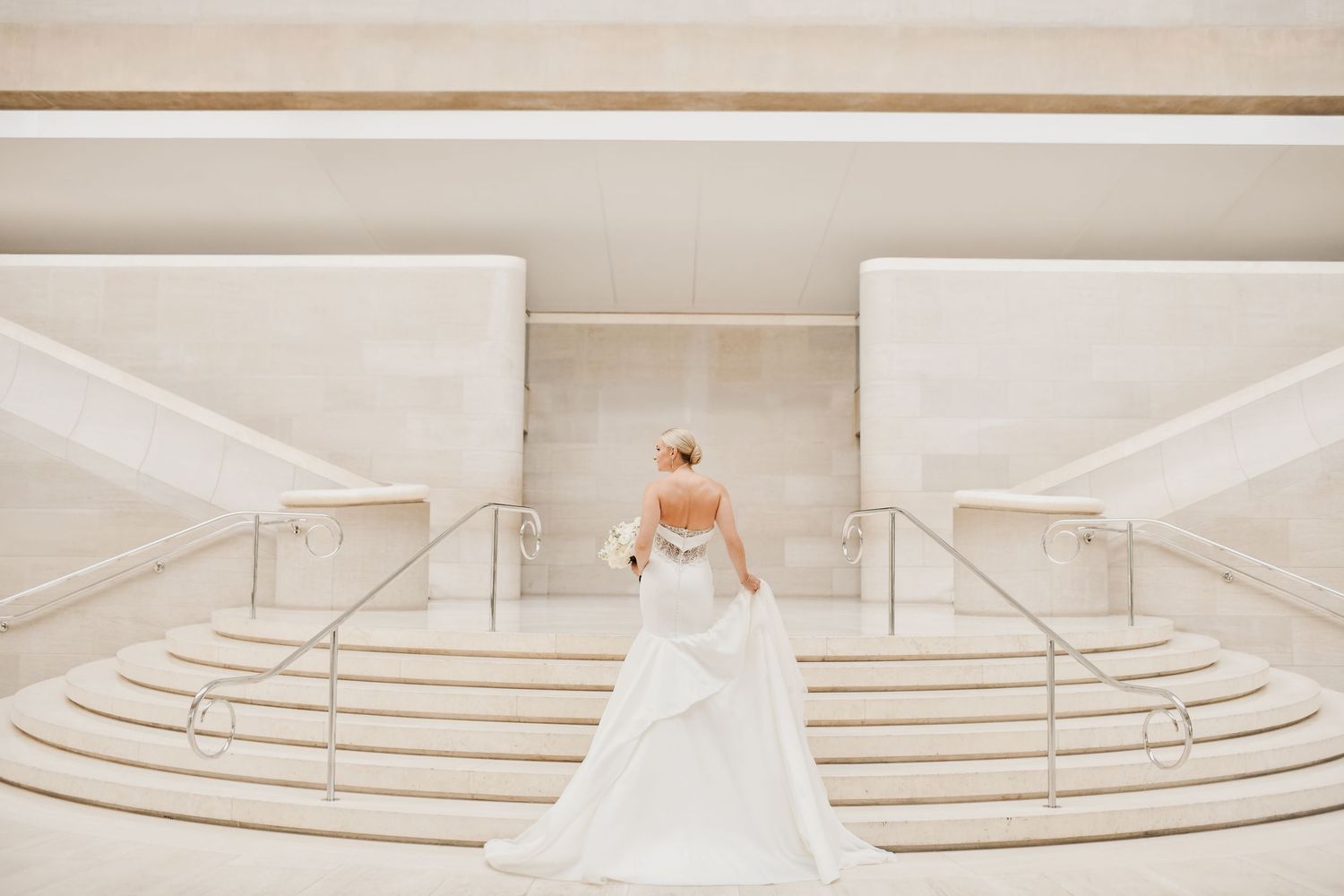 Modern editorial bridal portrait with sweeping staircases at the Meyerson Symphony Center