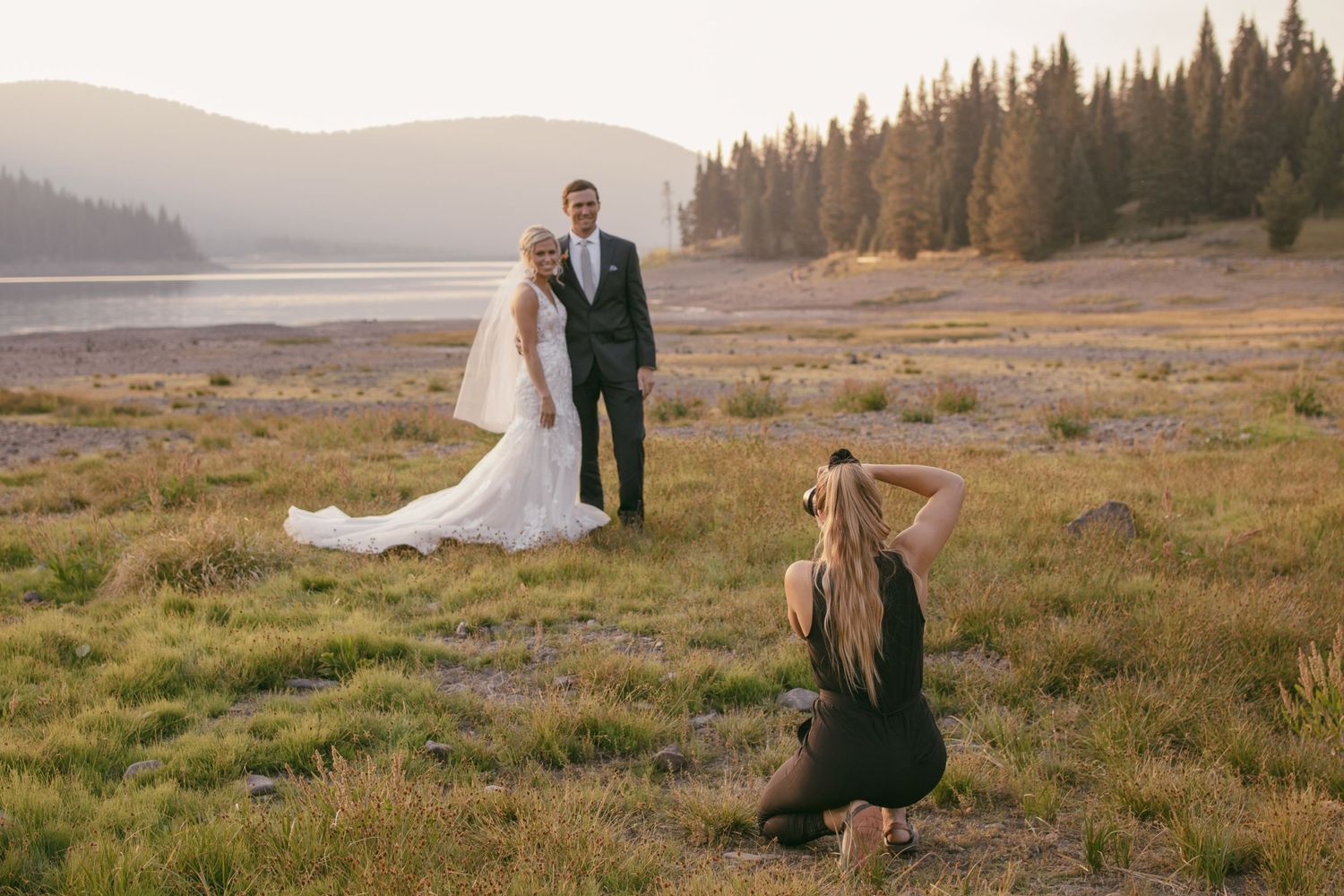 Claire Hamilton taking a picture of a wedding couple in Montana