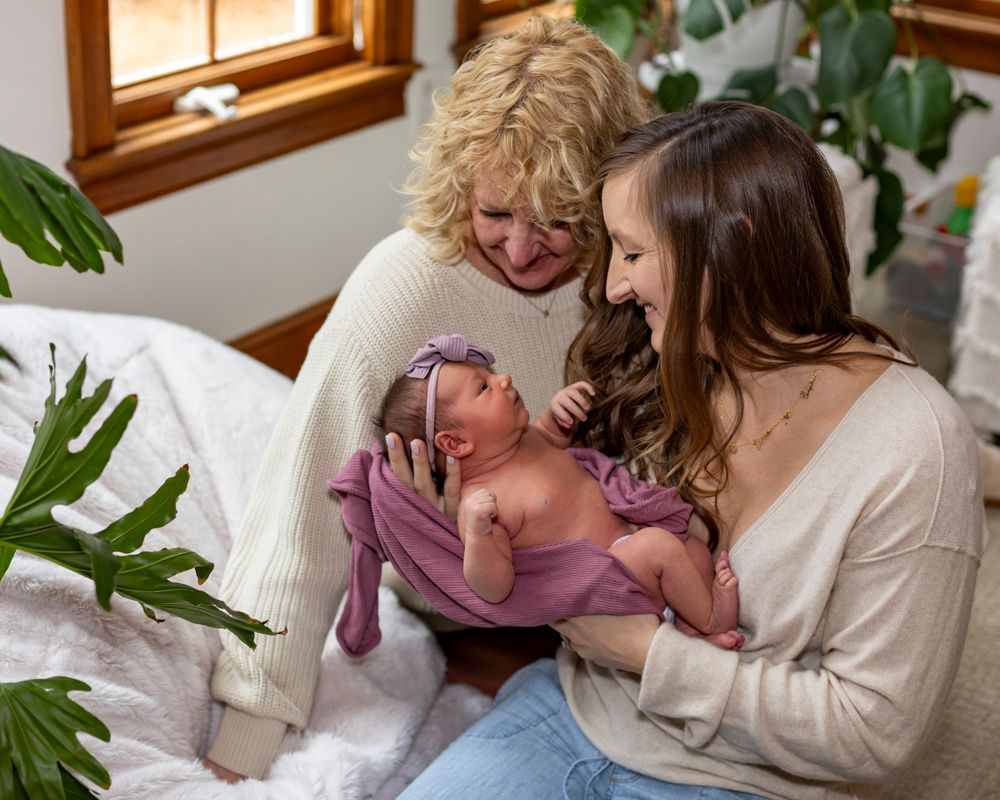 Family portrait at home in Sudbury, MA during newborn lifestyle photo session by Lisa West Photography based in Metrowest of Boston.